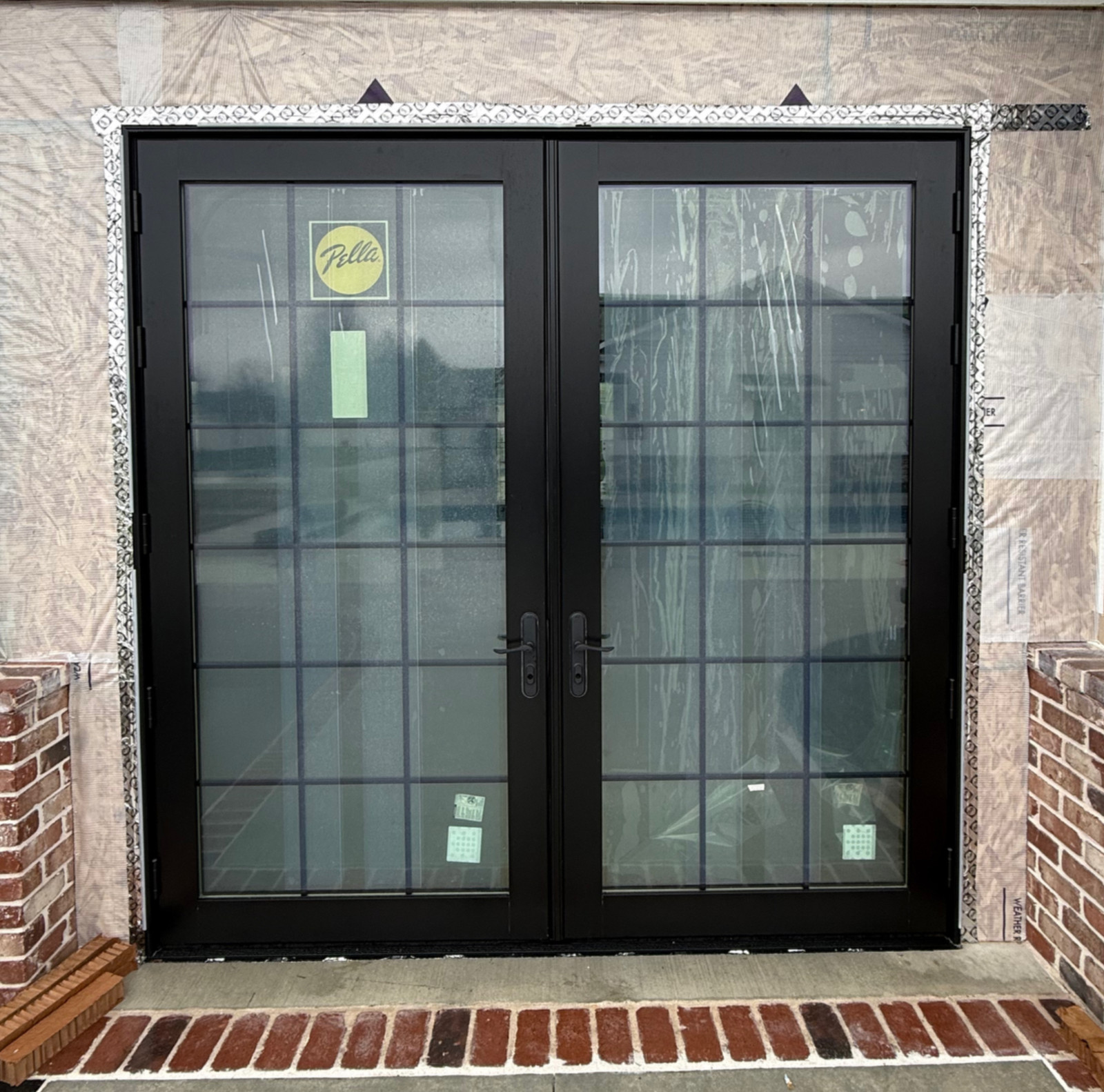 Entry door system installed and weather-stripped by Mbuilt