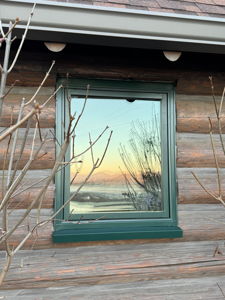 Pella window installed in an Inland Northwest log cabin